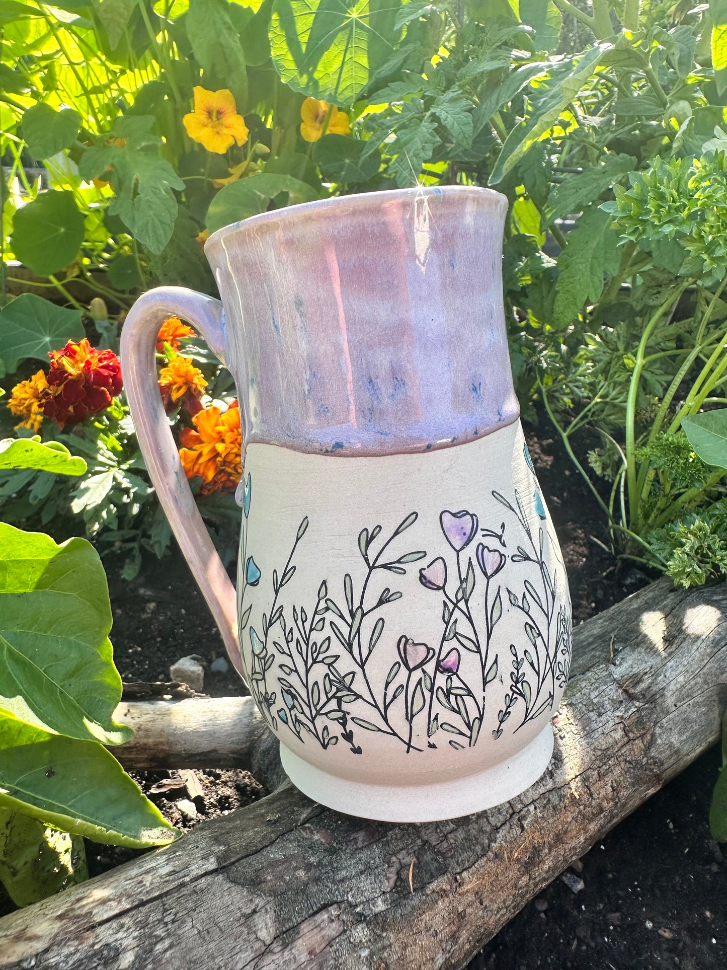 Handmade ceramic mug with wildflower design