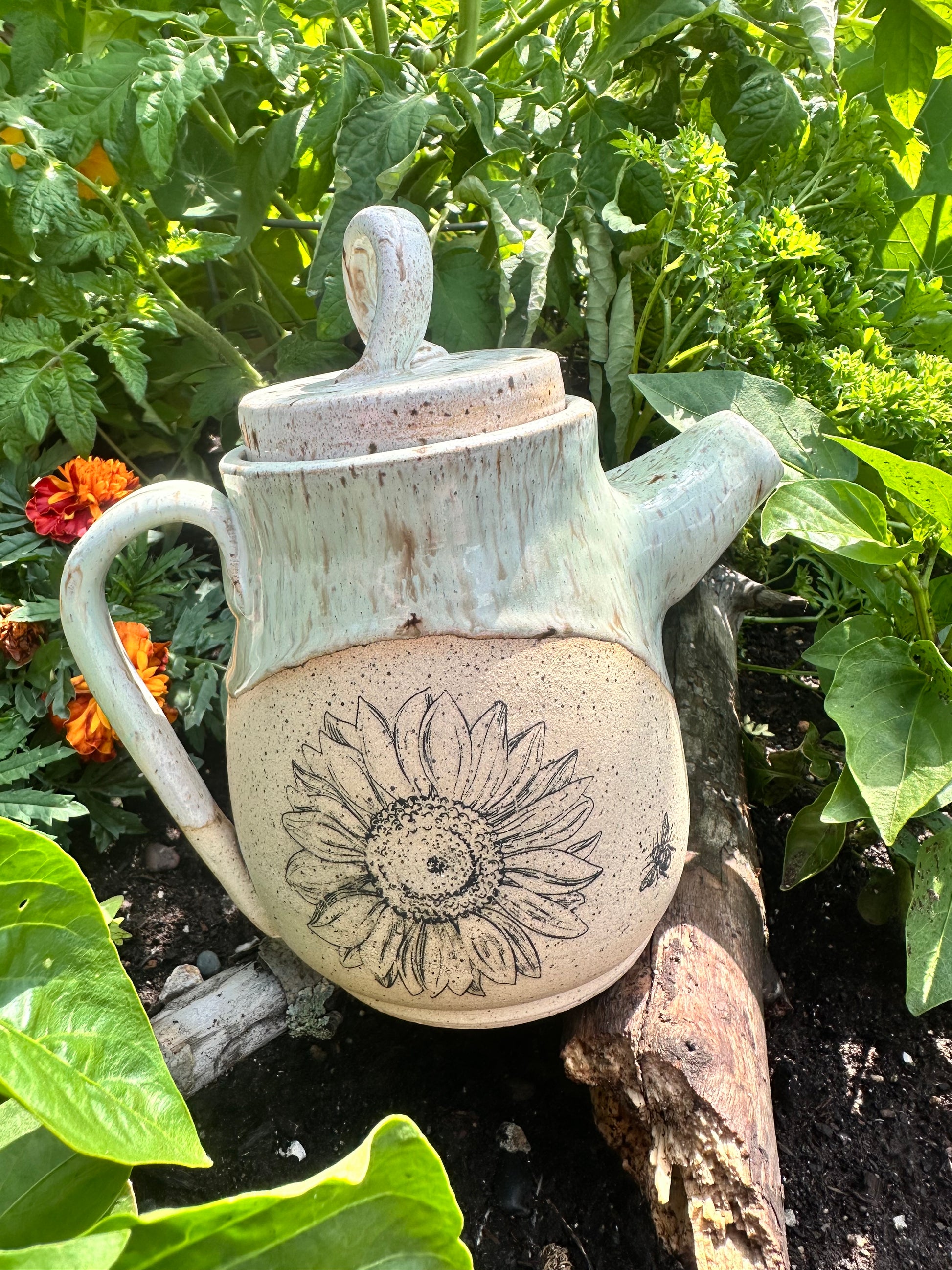 Handmade ceramic teapot with sunflower design 