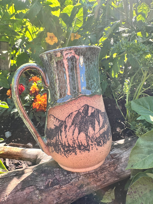 Handmade ceramic mug with mountain design 