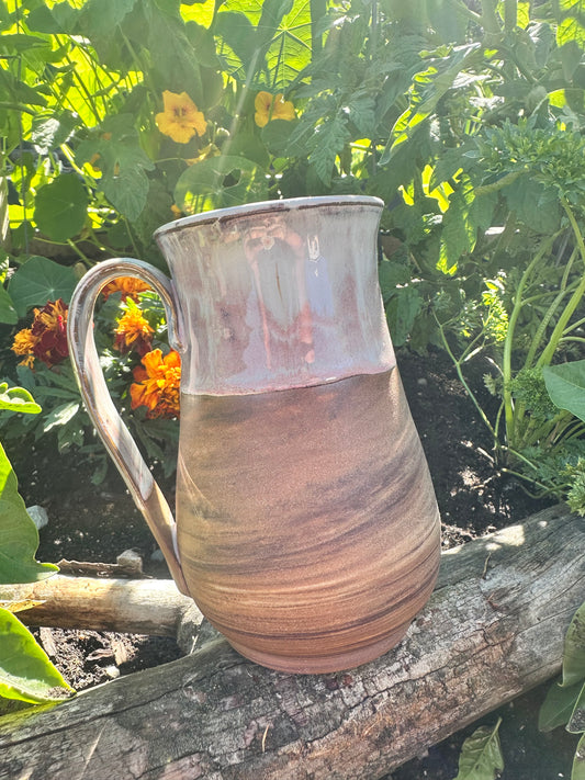 Handmade ceramic mug with spiral clay design 