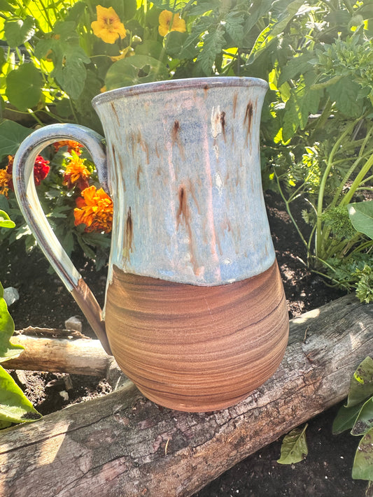 Handmade ceramic mug with spiral clay design 