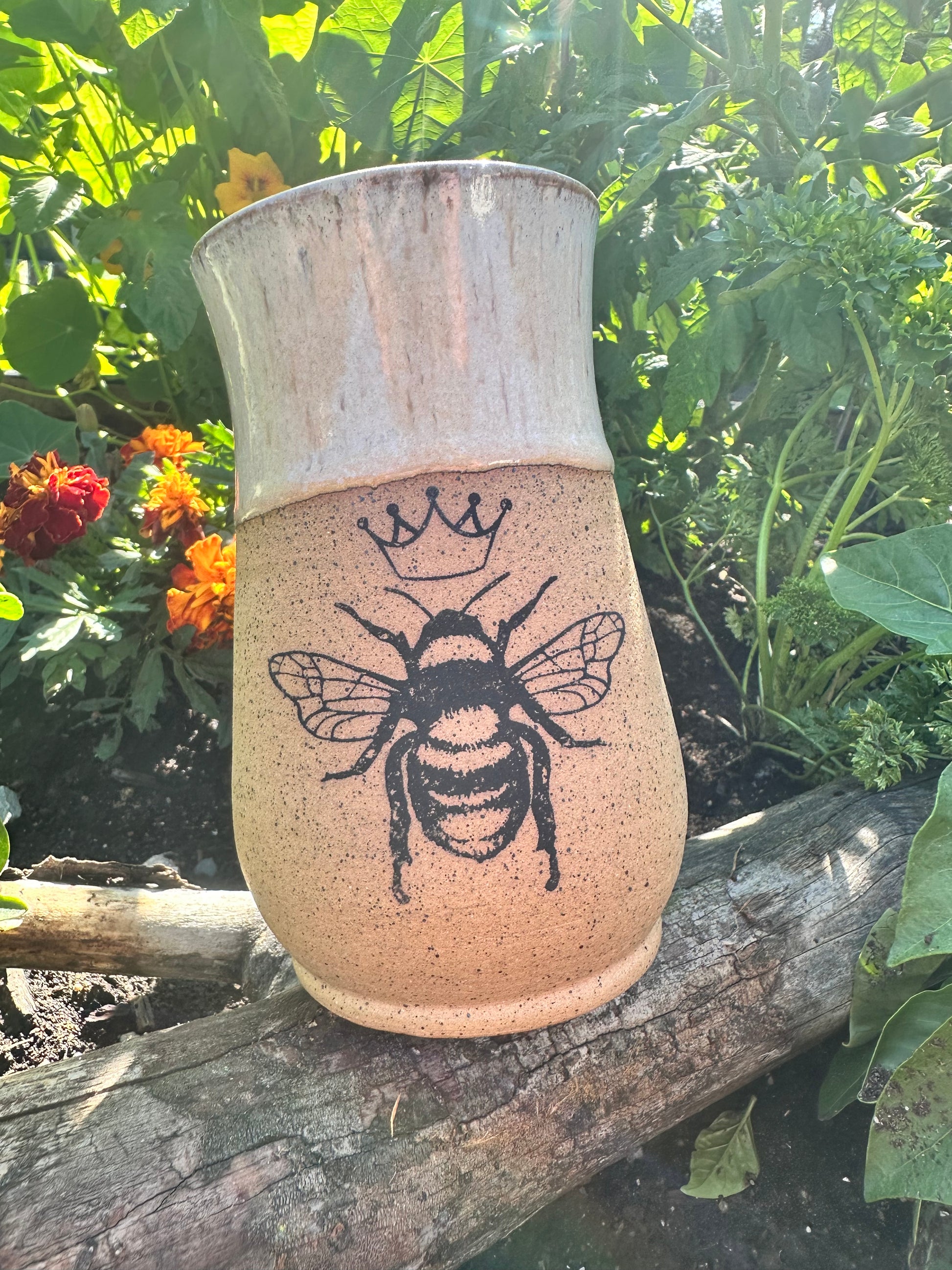 Handmade ceramic mug with queen bee design 