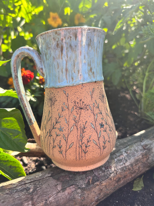 Handmade ceramic mug with wildflower design 