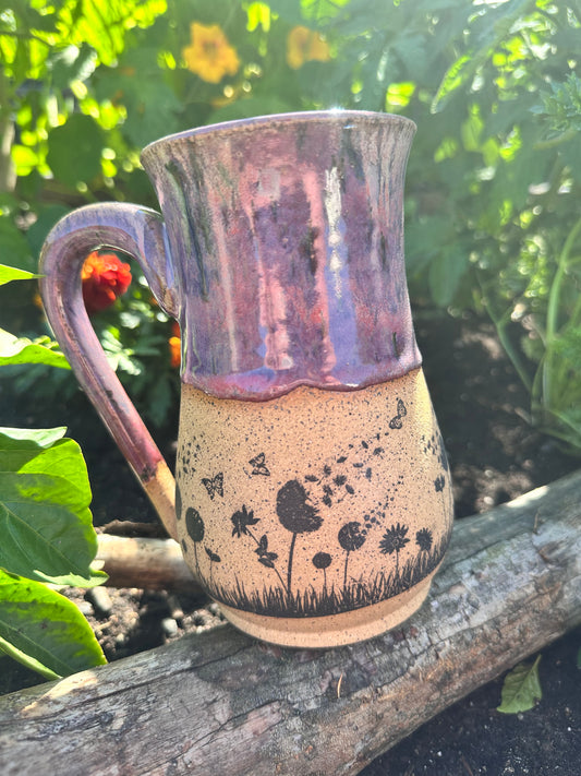Handmade ceramic mug with field flower design. 