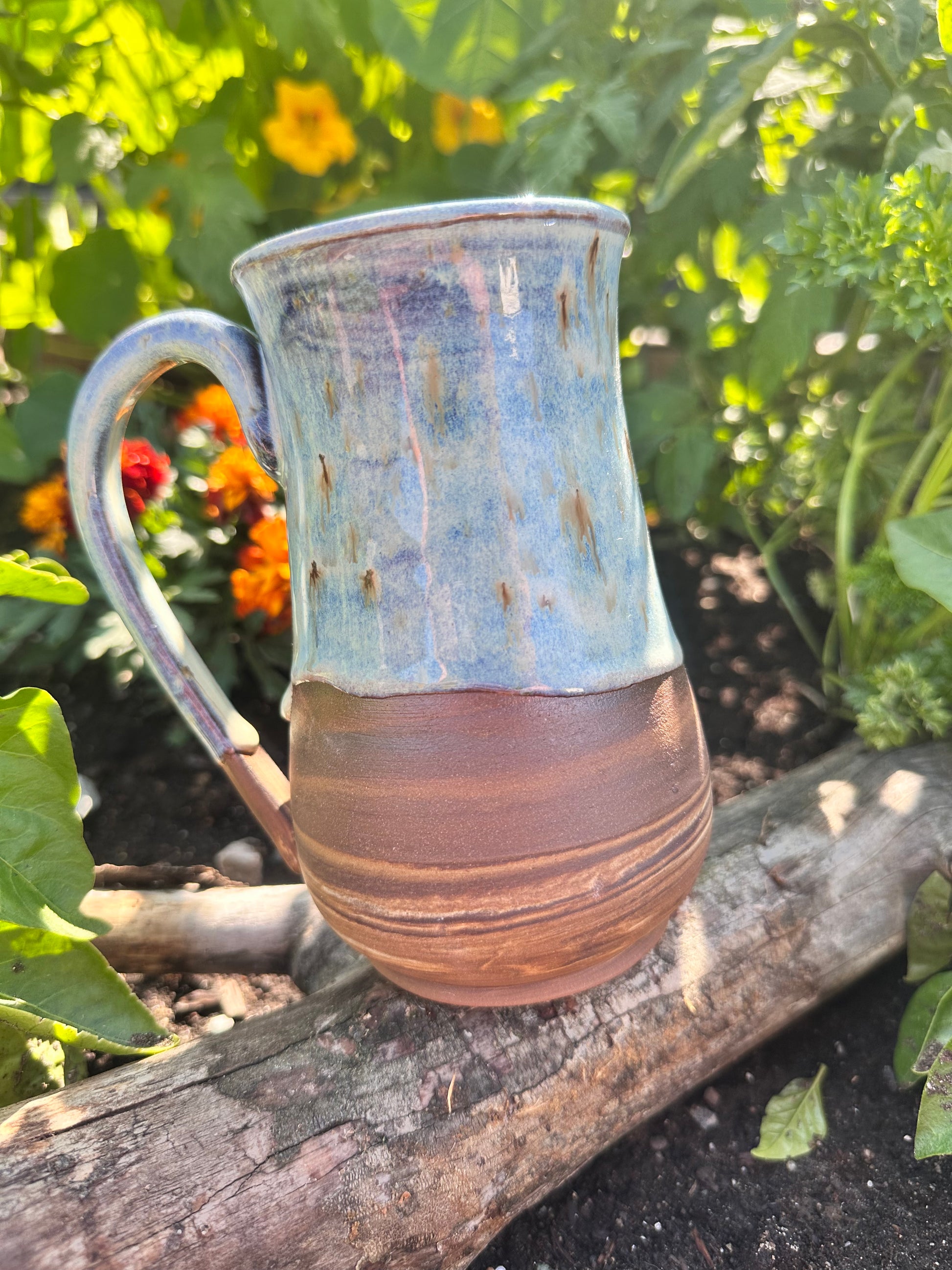 Handmade ceramic mug with spiral clay design. 