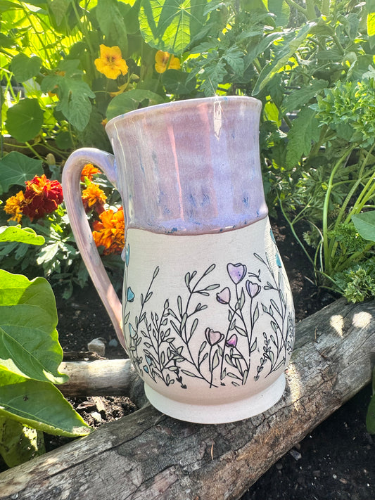 Handmade ceramic mug with wildflower design